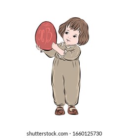 Little boy holds easter egg red color with inscription Christ is risen in Russian.