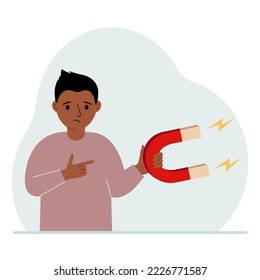 A little boy holds a huge magnet in his hand. Vector flat illustration