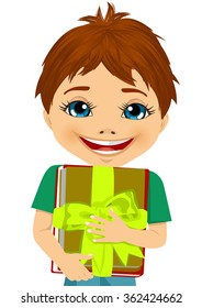 little boy hugging a stack of books decorated with a green ribbon
