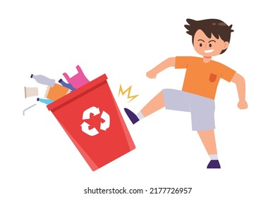 Little boy kicking a trash can