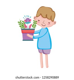 little boy lifting houseplant