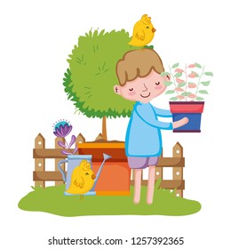 little boy lifting houseplant with chick