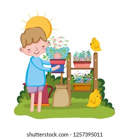 little boy lifting houseplant with chick