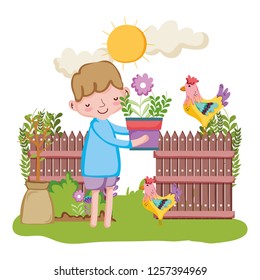 little boy lifting houseplant with fence and rooster