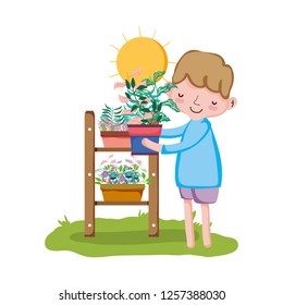little boy lifting houseplant with shelf in the garden