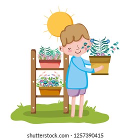 little boy lifting houseplant with shelf
