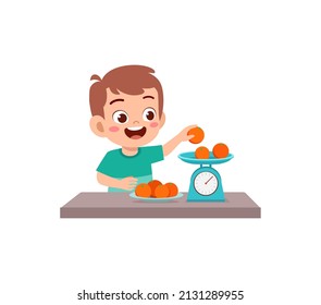 little boy measure weight of fruit using weighing scale