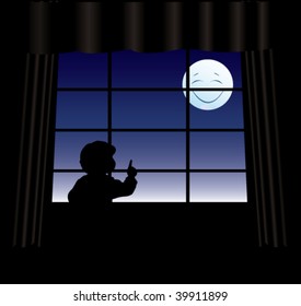 pequeño niño mira por la ventana