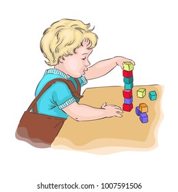Little boy play with cube
