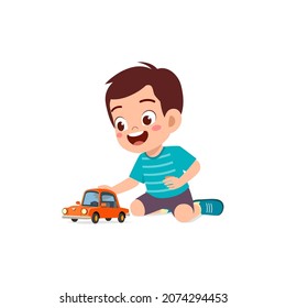 little boy play with small toy car