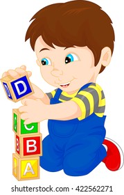little boy playing with alphabet block