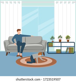 A little boy playing on the floor while young parents relaxing at home on sofa.