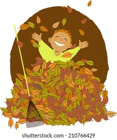 Little boy playing in a pile of fallen leaves, a rake laying near him