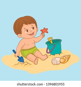 Little boy playing in the sand on the beach with beach toys