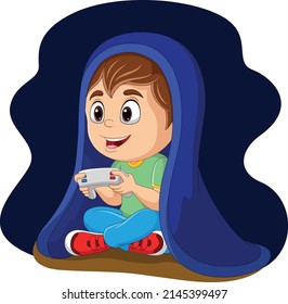 Little boy playing a video game under blanket