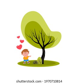 Little boy pointing to a tree he loves.