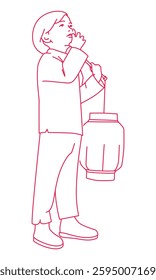 A little boy portable red lanterns to celebrate the New Yea