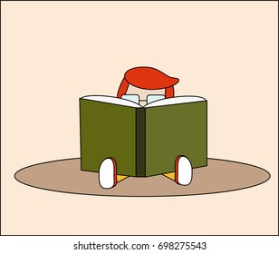 Little boy reading a book.