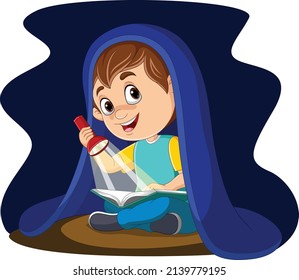 Little boy reading a book at night with flashlight under blanket