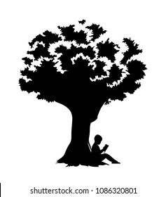 Little boy reading a book under a tree silhouette