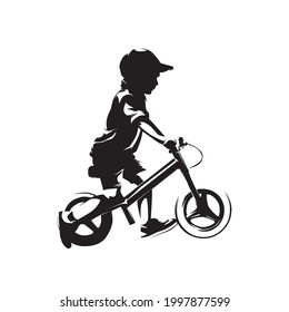 Little boy riding balance bike, side view isolated vector silhouette, no pedal bike, ink drawing