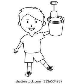 little boy with sand bucket