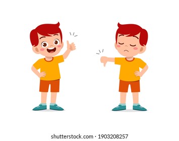 little boy show hand gesture thumb up and thumb down