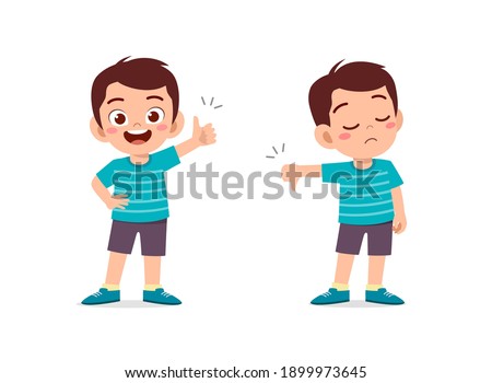 little boy show hand gesture thumb up and thumb down