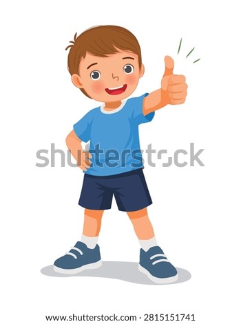 Little boy showing thumb up gesture