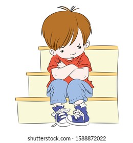 A little boy sitting on the stairs lonely, sad, upset and angry. Feelings of a child