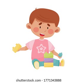 Little Boy Sitting and Playing with Construction Toy Vector Illustration