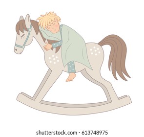 little boy sleeping on a rocking-horse 