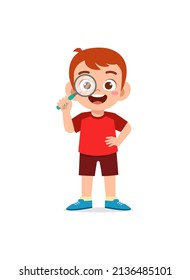 little boy standing and holding magnifying glass