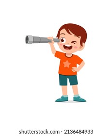 little boy standing and see using telescope