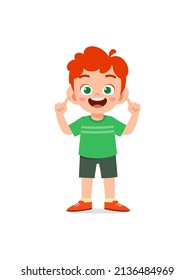 little boy standing and try to hear sound