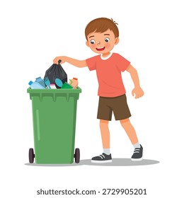 Niño pequeño que tira la basura en la papelera de reciclaje