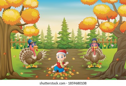 Little boy and turkeys bird playing with fallen leaves