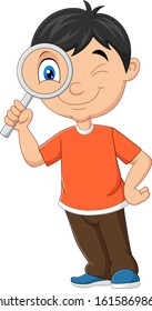 Little boy using magnifying glass