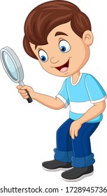 Little boy using a magnifying glass