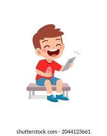 little boy using mobile phone and laugh