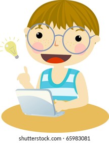 Little boy, very cute looking at computer