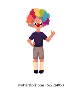 Little boy wearing clown nose and rainbow colored wig showing thumb up, cartoon vector illustration isolated on white background. Full length portrait of little boy wearing clown red nose and wig