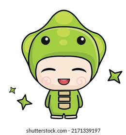 a little boy is wearing a dino costume and he is very happy