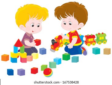 Little boys play with a toy train and bricks