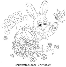 Little bunny with a happy Easter greeting and with a decorated basket of painted eggs