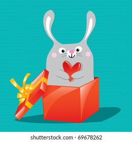 Little bunny holding heart in gift box, valentine present