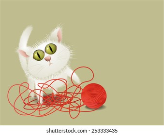 Little cat playing with ball of wool