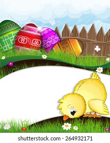 Little chick grazing in the meadow. Easter eggs near a wooden fence in the background