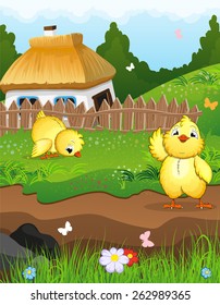 Little chicks on a green meadow in front of a farmhouse with a thatched roof. Rural landscape