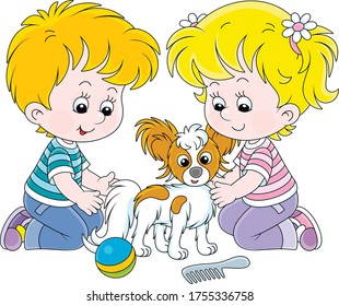 Little children brushing their cheerful small Papillon puppy for a walk, vector cartoon illustration on a white background